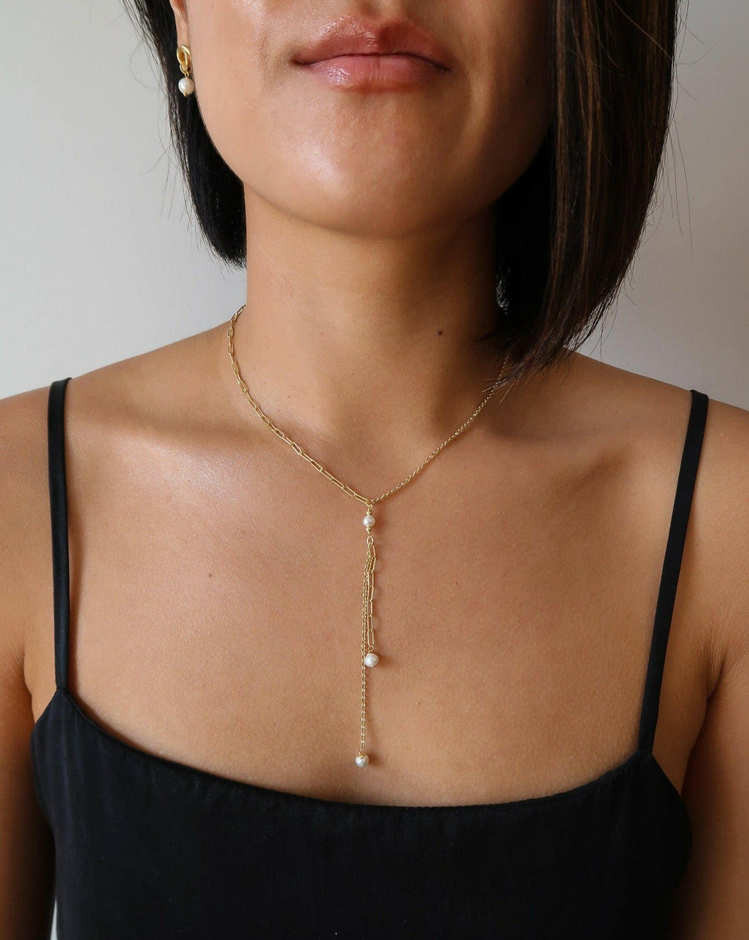 gold and pearl lariat necklace with pearls dripping down, zoomed out