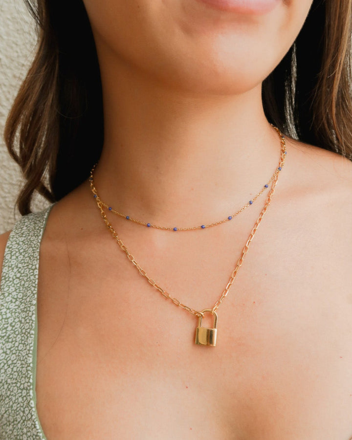 gold padlock necklace layered with dainty necklace, necklace layering ideas